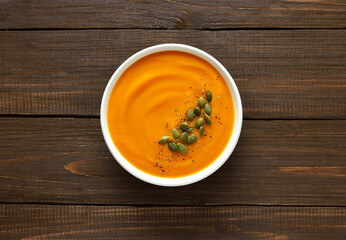 Homemade creamy pumpkin soup in bowl