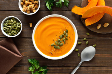 Homemade creamy pumpkin soup in bowl