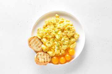 Delicious scrambled eggs on plate