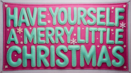 Festive decoration with colorful letters wishing a merry little Christmas on a bright pink backdrop