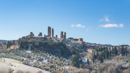 Naklejka premium Snowy Winter Landscape of San Gimignano Medieval Towers, Tuscany