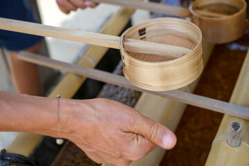 Hand with hishaku at chozuya in Shitenno-ji Temple, Osaka