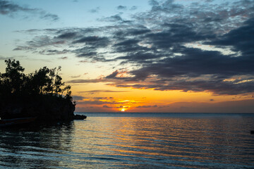 Obraz premium Sunset on Lia beach, Waleakodi Island, Togian archipelago, Sulawesi, Indonesia