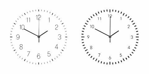 Two analog clocks displaying slightly different times in a minimalist style
