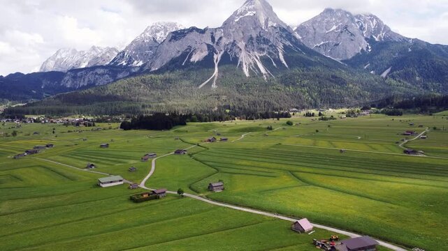 A perfect representation of rural European life, summer tourism, and majestic nature in the Tyrolean Alps