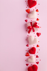 Gift box decorated with various love hearts on pink background. Valentine Day or Mother Day greeting card vertical template.