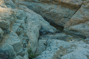 Rock formations with a little stream through it.