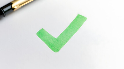 A green checkmark on white paper symbolizes approval, completion, and accuracy. The adjacent fountain pen adds a touch of professionalism and signifies the act of marking a task complete.