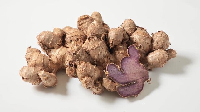 fresh black galingale on white background