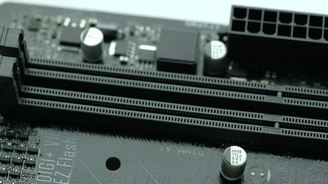 KYIV, UKRAINE - DECEMBER 20, 2025: Slots for ddr memory on computer motherboard 