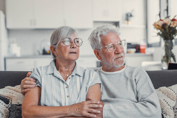 Senior woman in husband embrace comforting thoughtful sad mood. Marital support in hardships,...