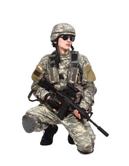 Naklejka premium An American soldier, holding a rifle, knelt down on one knee.