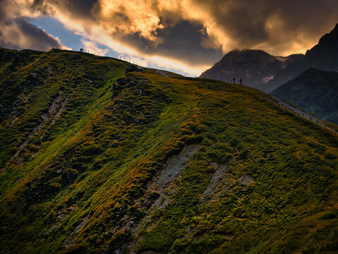 Scenic fantasy landscape with rocks, cliffs and high mountains, dramatic sky, Creative post processing