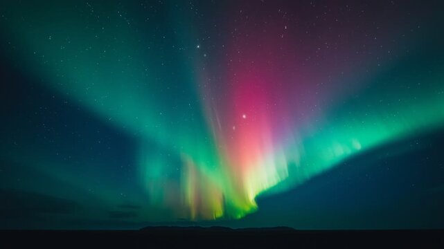 Mesmerizing aurora borealis dancing across a starry night sky, creating vibrant green and purple light waves over a dark horizon. Perfect for nature, astronomy, and atmospheric backgrounds.