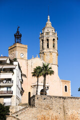 Church of Saint Bartholomew and Saint Thecla against blue sky. Sitges, Spain
