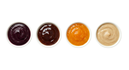 Assorted flavorful sauces in small bowls arranged in a straight line isolated on transparent