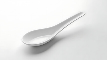 White ceramic spoon on a clean white background
