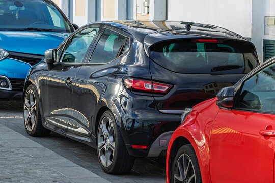 Cars parked on the side of the street. Urban infrastructure, parking and environmental planning