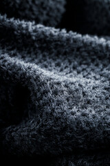 Texture of black fleece, shaggy high-tech synthetic knit