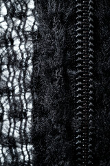 Zipper for clothes black on fleece fabric in macro