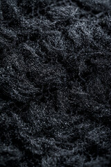 Texture of black fleece, shaggy high-tech synthetic knit