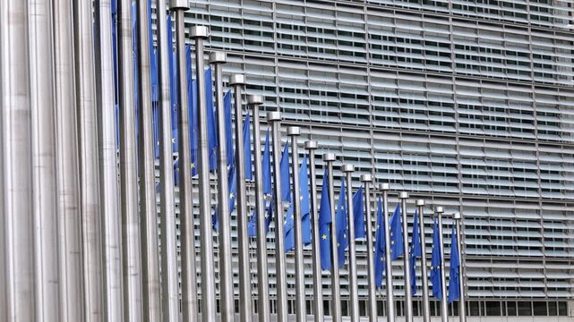 European Union Flags Waving In Front Of The Brussels Commission Headquarters In Brussels, Belgium