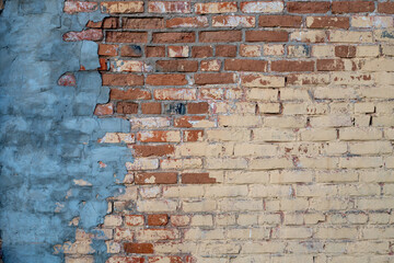 Background with texture of old dirty brick wall and cement. Old broken bricks, close-up.