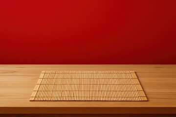 Wooden table with bamboo mat on red background ideal for Chinese New Year product mockups