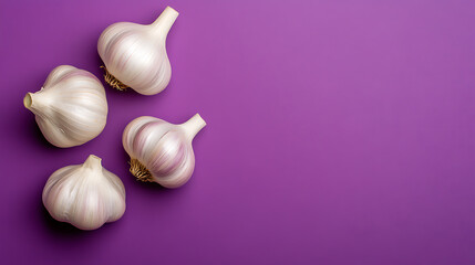 Four bulbs of garlic are arranged artfully on a vibrant purple background. The bulbs are clustered on the left side, leaving the right side clear for text overlay or other design elements.