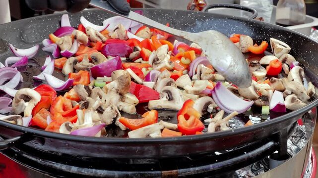 Brightly cooked vegetables sizzling quickly, Assorted vegetables frying in hot pan, An array of colorful vegetables rapidly cooking in heated skillet for flavor