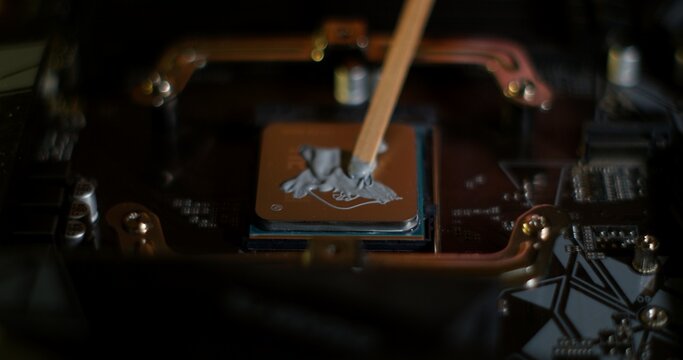 Applying Thermal Paste on Computer CPU During Replacement