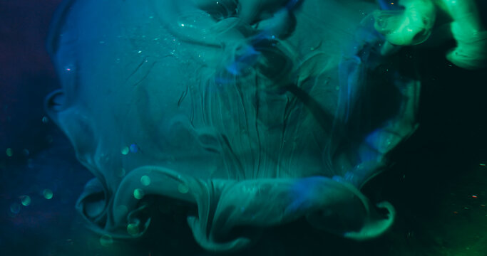 Dye spill. Blur paint wave. Sparkling green blue acrylic liquid pouring on art sphere. Color water shimmering mix bokeh light abstract background. - Powered by Adobe