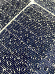 solar panel surface with clear water drops