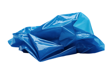 A crumpled piece of shiny blue plastic material with many folds and reflections on a white background.