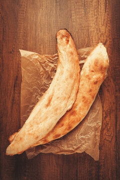 Georgian bread shotis, shotis puri, on a wooden table, top view,