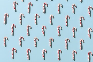 Candy cane pattern on blue background for holidays