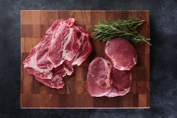 Two types of beef fillet on a wooden board. Beef steaks. Fresh raw meat. Beef tenderloin. Juicy pieces of meat. Flat lay.Top view.