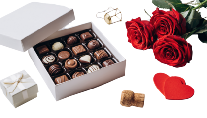Valentine day romantic gift of assorted chocolates with red roses and heart shapes on a clean white background cutout