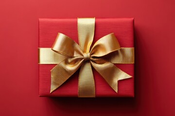 Festive red present with golden bow