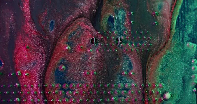Paint pour. Digital hardware. Defocused red purple blue colorful sparkling water round glitter microchip texture on abstract background.