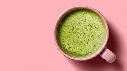 Cranberry matcha latte in modern cup, pastel green background, clean composition