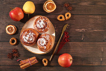 Buns or muffins with nuts, cinnamon, poppy seeds and apples, as well as egg liqueur.Festive kitchen banner. The concept of festive pastries, seasonal treats and cafe advertisements, restaurant menus