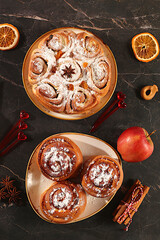 Apple pies, buns, cupcakes with apples, cinnamon, poppy seeds, cranberries, and egg liqueur.Homemade winter dessert,Festive kitchen banner. The concept of festive pastries, seasonal treats