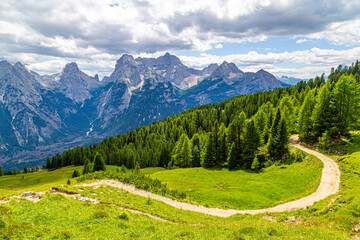 Tourist trail in Dolomites mountain at summer