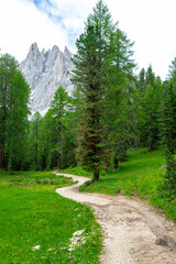 Tourist trail in Dolomites mountain at summer