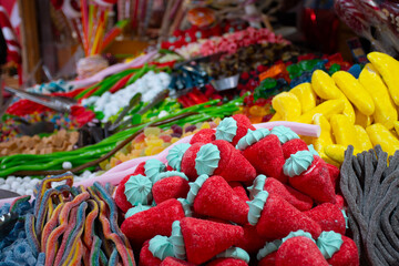 sugary candy stall at colorful street fair close-up © mario