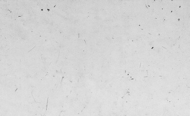 Soft minimalist paper background with visible fibers and organic speckles. Neutral monochrome surface ideal for calm, wabi-sabi, and fine art design uses.