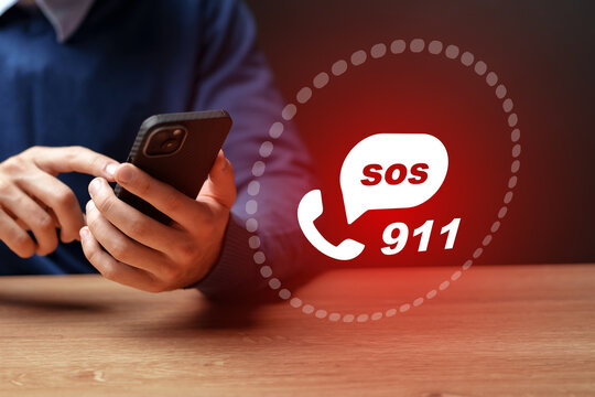 Person calling for help using a mobile phone to reach emergency services