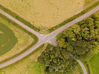 Northumberland England: Aug 2025: Country roads meet at a junction in Northumberland England surrounded by fields and trees
