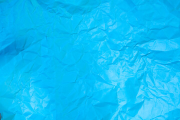 Blue crumpled paper texture background. Crumpled paper background.